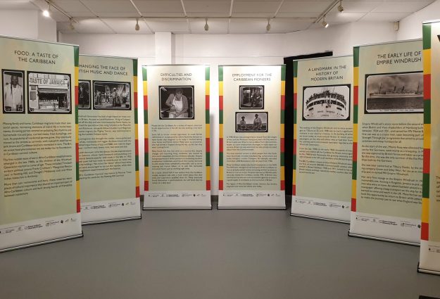 An image of the pull up pop up Windrush exhibition in situ at Thameside in Grays, Thurrock