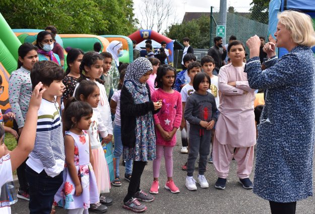 An image of Vicky Ford MP surround by children at the Essex ActivAte Club